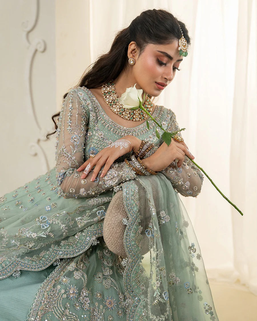 Selin lehenga set in mint green organza with heritage embroidery, paired with raw silk skirt and embroidered dupatta—perfect for weddings and festive celebrations.