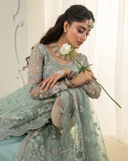 Selin lehenga set in mint green organza with heritage embroidery, paired with raw silk skirt and embroidered dupatta—perfect for weddings and festive celebrations.