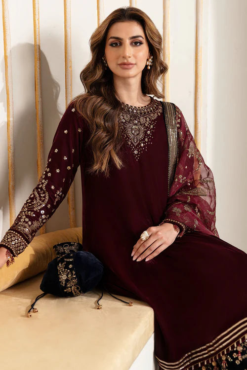 Elegant pure velvet dress with embroidered front, sleeves, and trouser. Paired with organza dupatta for a luxurious and graceful formal look.