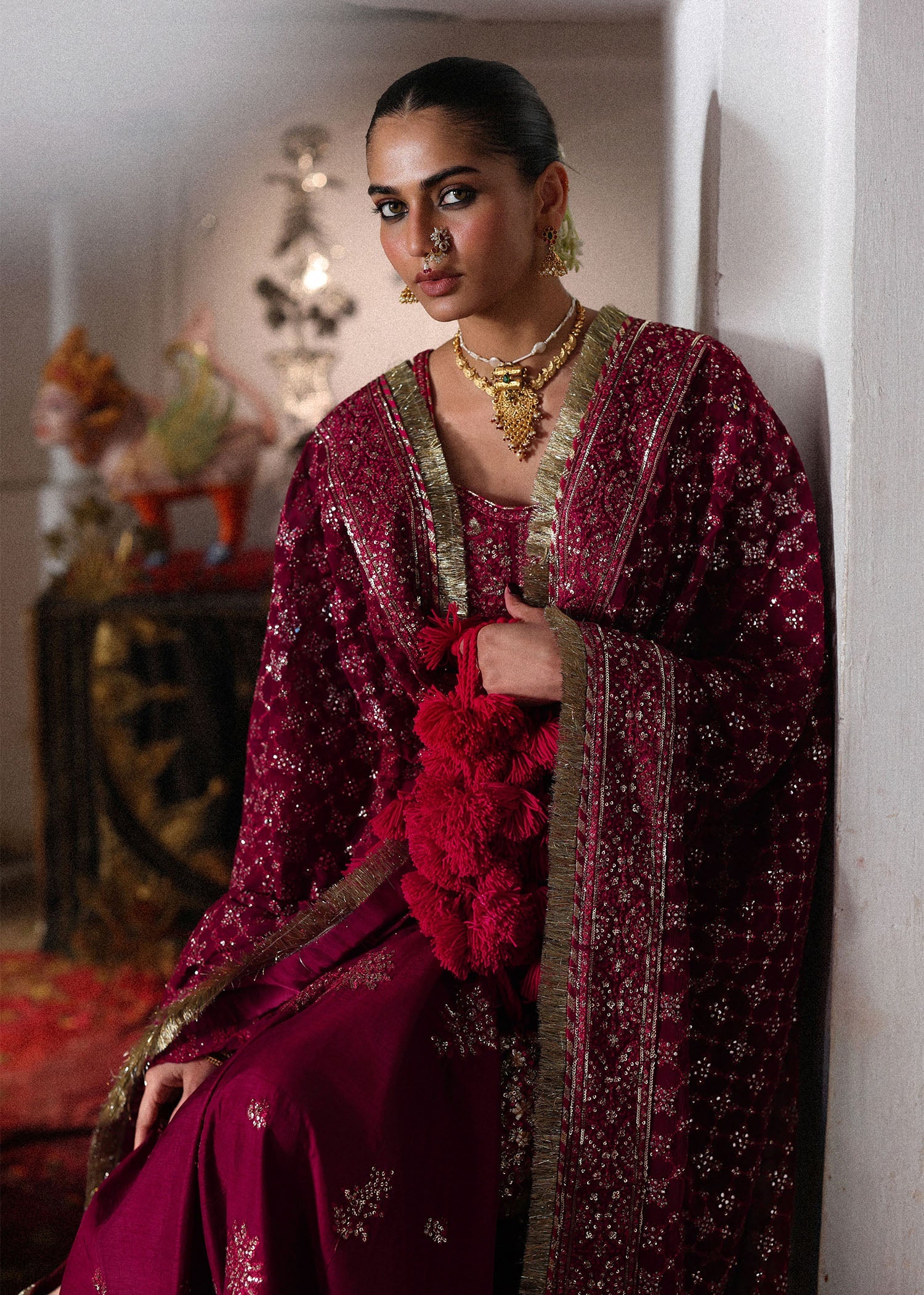 Elegant hot pink embroidered pishwas with detailed panels, Korean raw silk chooridar and a chiffon dupatta featuring all-over jaal and four sided borders.