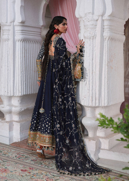 Elegant navy blue Korean raw silk pishwas with embroidered panels and sleeves, paired with printed chooridar and chiffon dupatta with four-sided borders.
