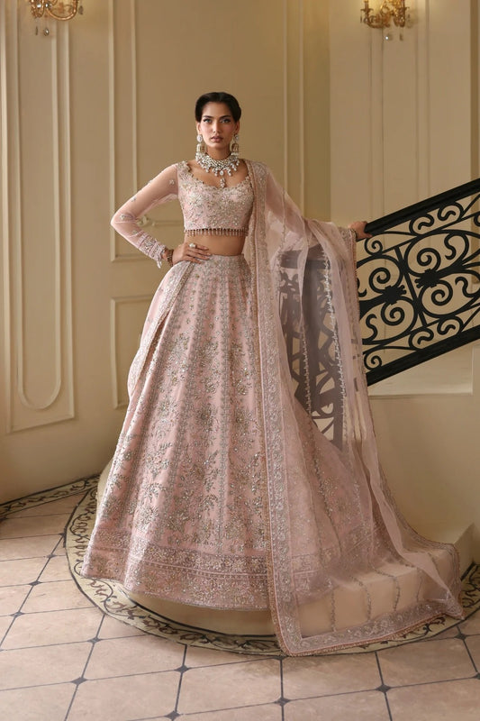 Exquisite net dress featuring hand-embellished body, sleeves, panels, and dupatta. Finished with organza kalli borders and Russian grip inner for layering.