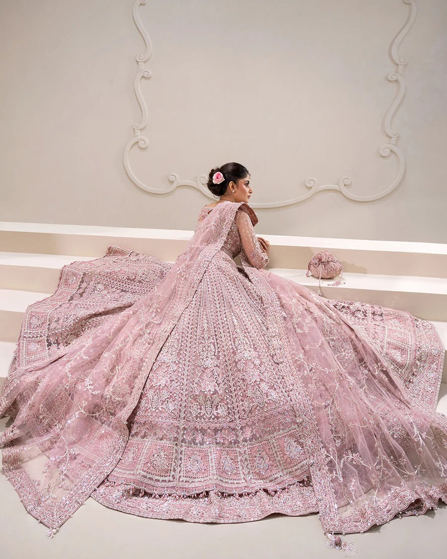 Exquisite Leyan lehenga set in dusty pink net with intricate embroidery on blouse, lehenga, and dupatta. Perfect for weddings, festive occasions, and formal events.