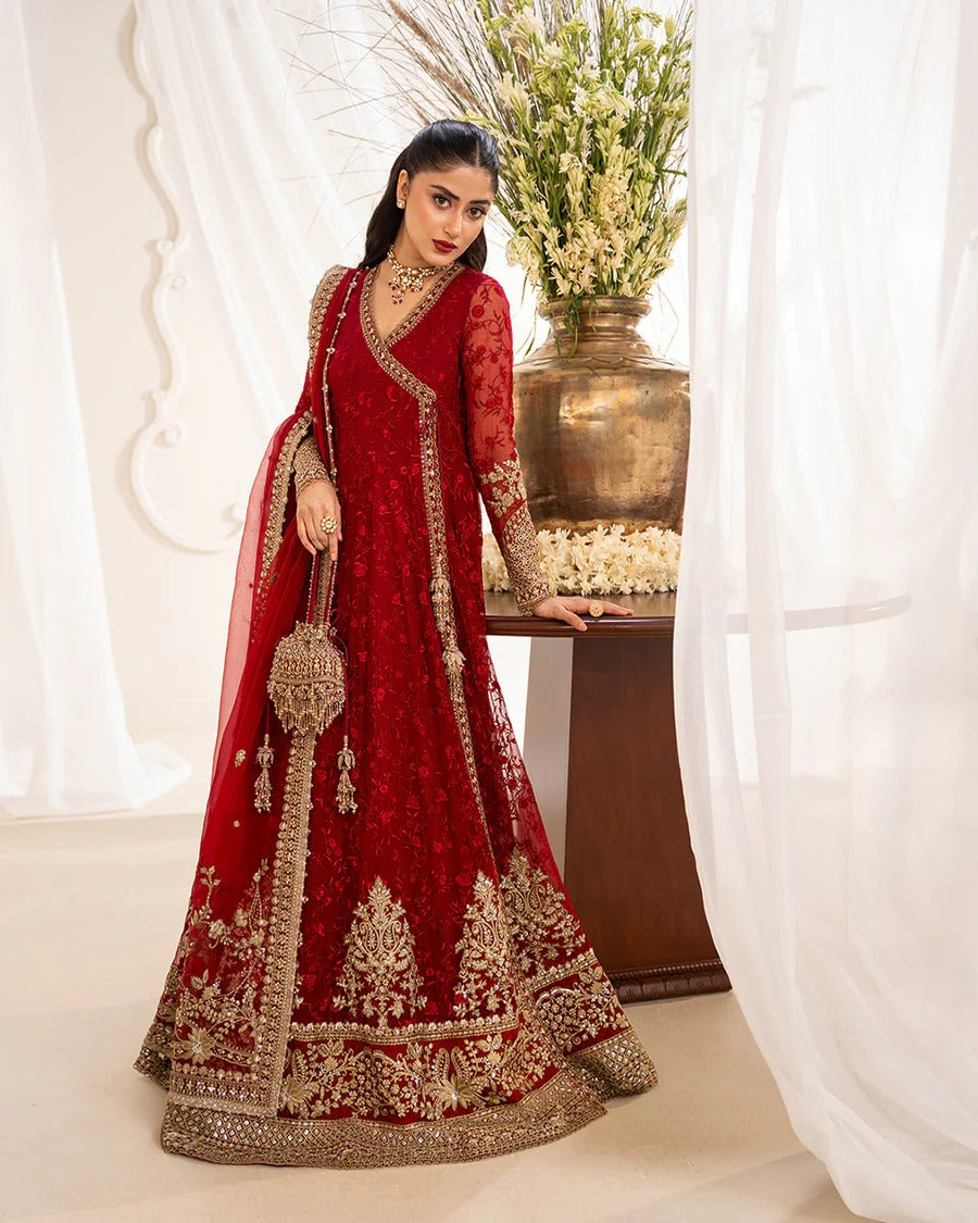 Gul festive set in vibrant scarlet chiffon with intricate embroidery, paired with silk churidar and organza dupatta—perfect for weddings and celebratory occasions.