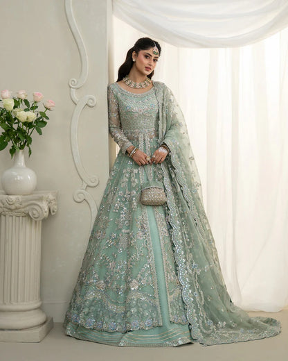 Selin lehenga set in mint green organza with heritage embroidery, paired with raw silk skirt and embroidered dupatta—perfect for weddings and festive celebrations.