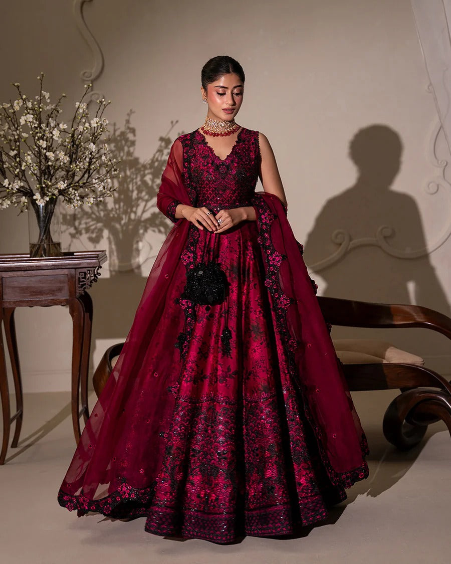 Havin set in dark magenta shamose silk with printed and embroidered shirt, paired with embroidered organza/net dupatta and silk trousers—perfect for festive occasions.