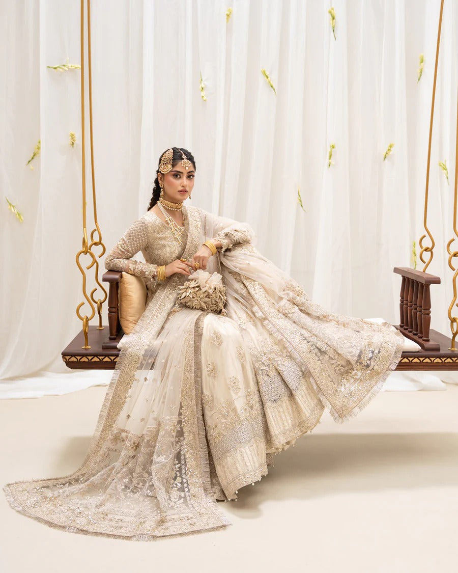 Safak ivory net gharara set with gold embroidery, featuring detailed shirt panels, embroidered dupatta, and gharara—perfect for weddings and festive celebrations.