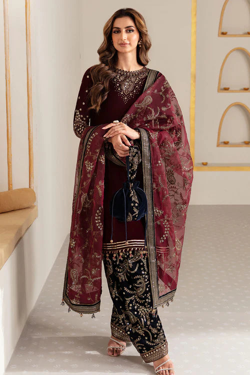 Elegant pure velvet dress with embroidered front, sleeves, and trouser. Paired with organza dupatta for a luxurious and graceful formal look.