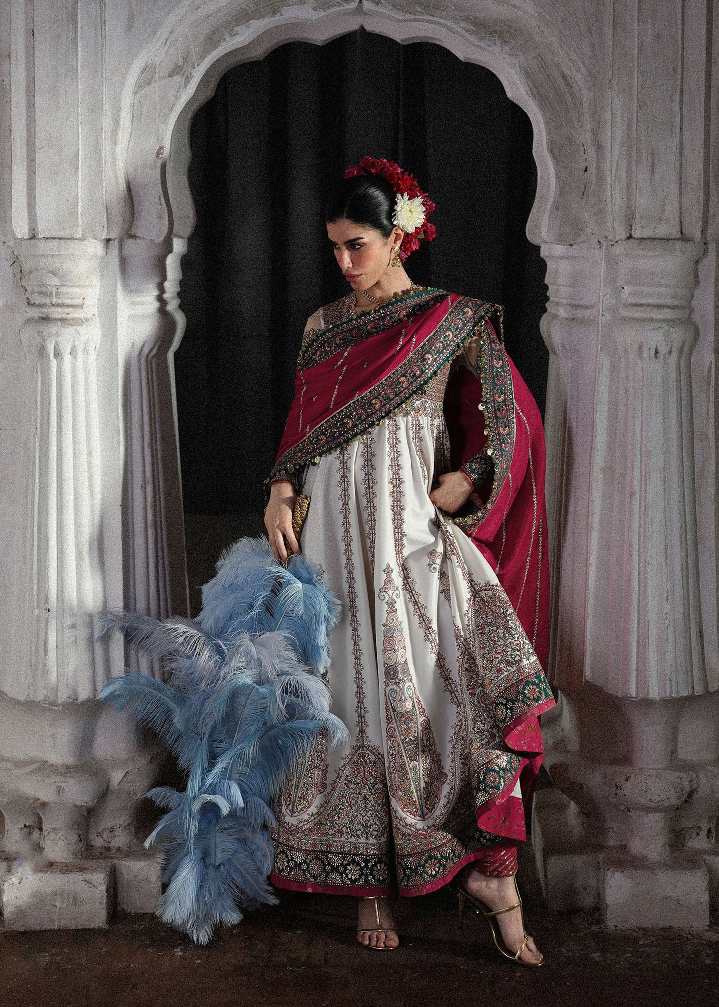 Elegant ivory embroidered pishwas with detailed panels, net sleeves, printed Korean raw silk chooridar and an embroidered Korean silk shawl for formal events.