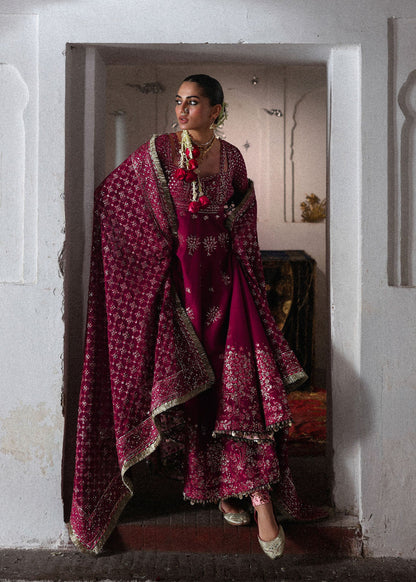 Elegant hot pink embroidered pishwas with detailed panels, Korean raw silk chooridar and a chiffon dupatta featuring all-over jaal and four sided borders.