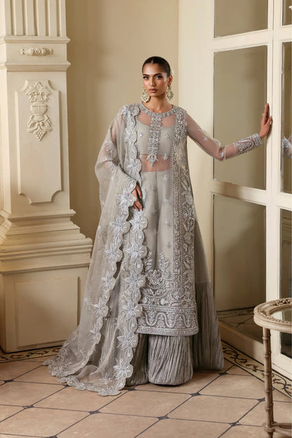 Elegant organza outfit with hand-embellished front, sleeves, and borders. Comes with embroidered dupatta, Russian grip inner, and 6 yards of raw silk trouser.