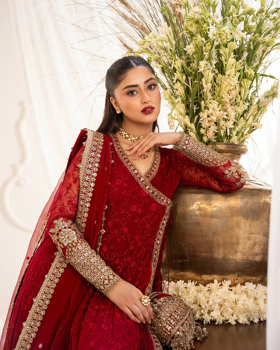 Gul festive set in vibrant scarlet chiffon with intricate embroidery, paired with silk churidar and organza dupatta—perfect for weddings and celebratory occasions.