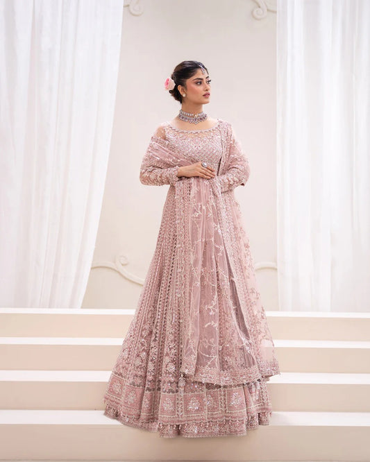 Exquisite Leyan lehenga set in dusty pink net with intricate embroidery on blouse, lehenga, and dupatta. Perfect for weddings, festive occasions, and formal events.