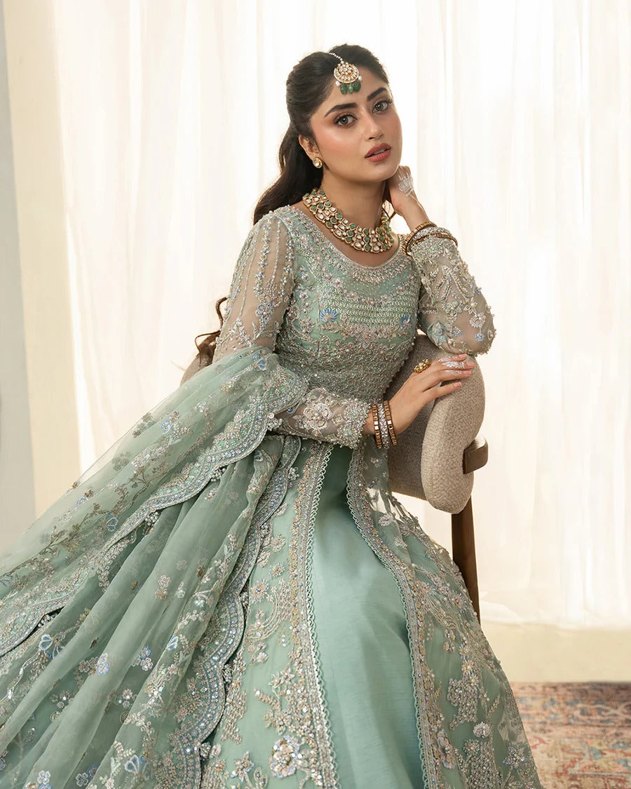 Selin lehenga set in mint green organza with heritage embroidery, paired with raw silk skirt and embroidered dupatta—perfect for weddings and festive celebrations.