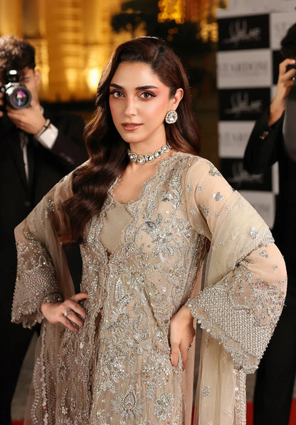 Stardust by Elaf Stardom ’25 features hand-embroidered organza panels, embroidered poly-net dupatta, and raw silk inner — ideal for festive and formal elegance.