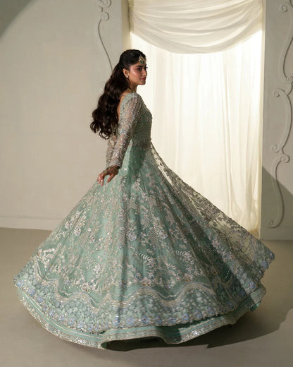 Selin lehenga set in mint green organza with heritage embroidery, paired with raw silk skirt and embroidered dupatta—perfect for weddings and festive celebrations.