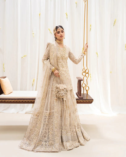 Safak ivory net gharara set with gold embroidery, featuring detailed shirt panels, embroidered dupatta, and gharara—perfect for weddings and festive celebrations.