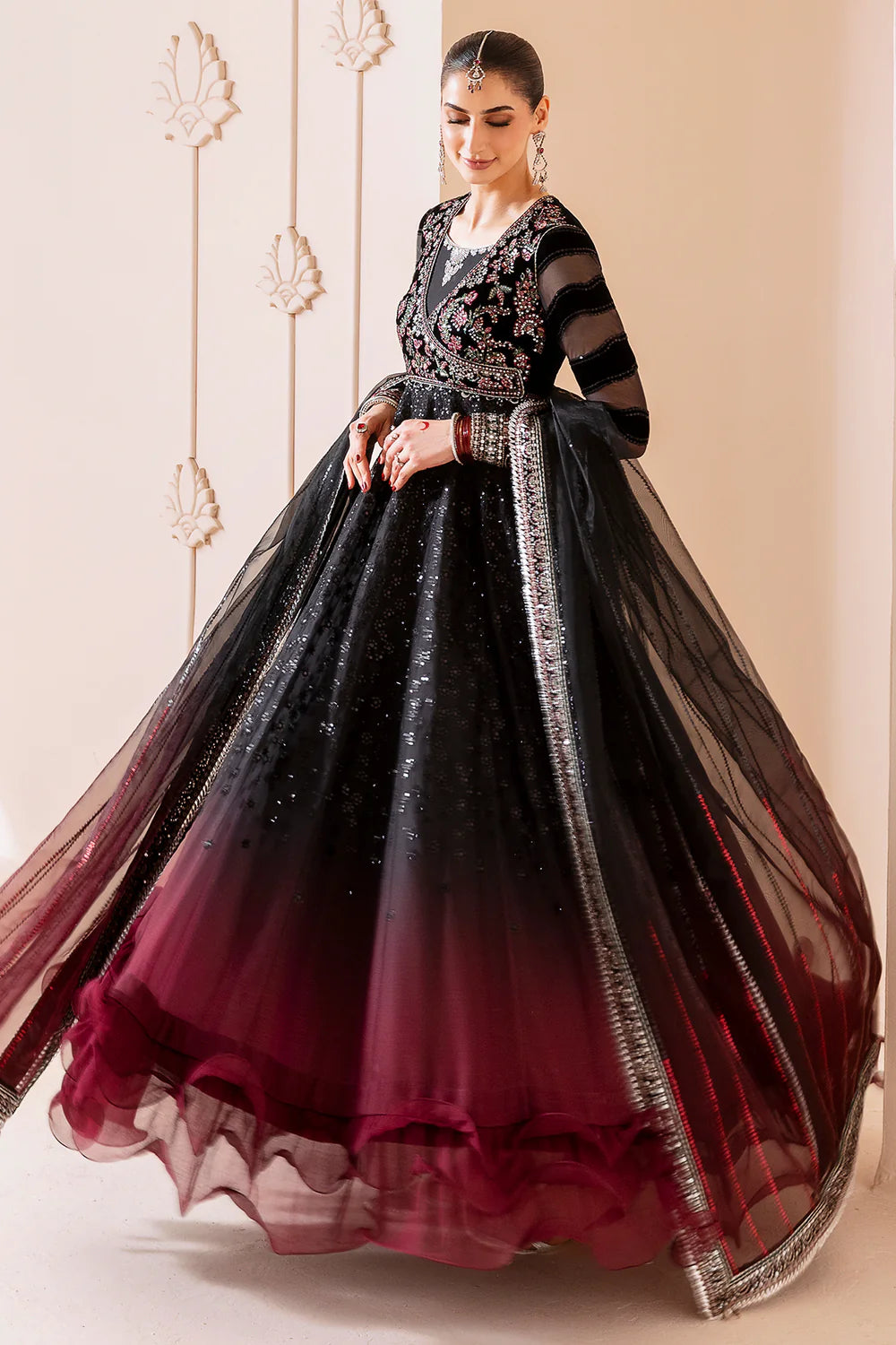 Elegant formal suit with embroidered velvet, laser-embellished chiffon sleeves, and digital printed chiffon panels. Includes digital organza dupatta & silk lining.