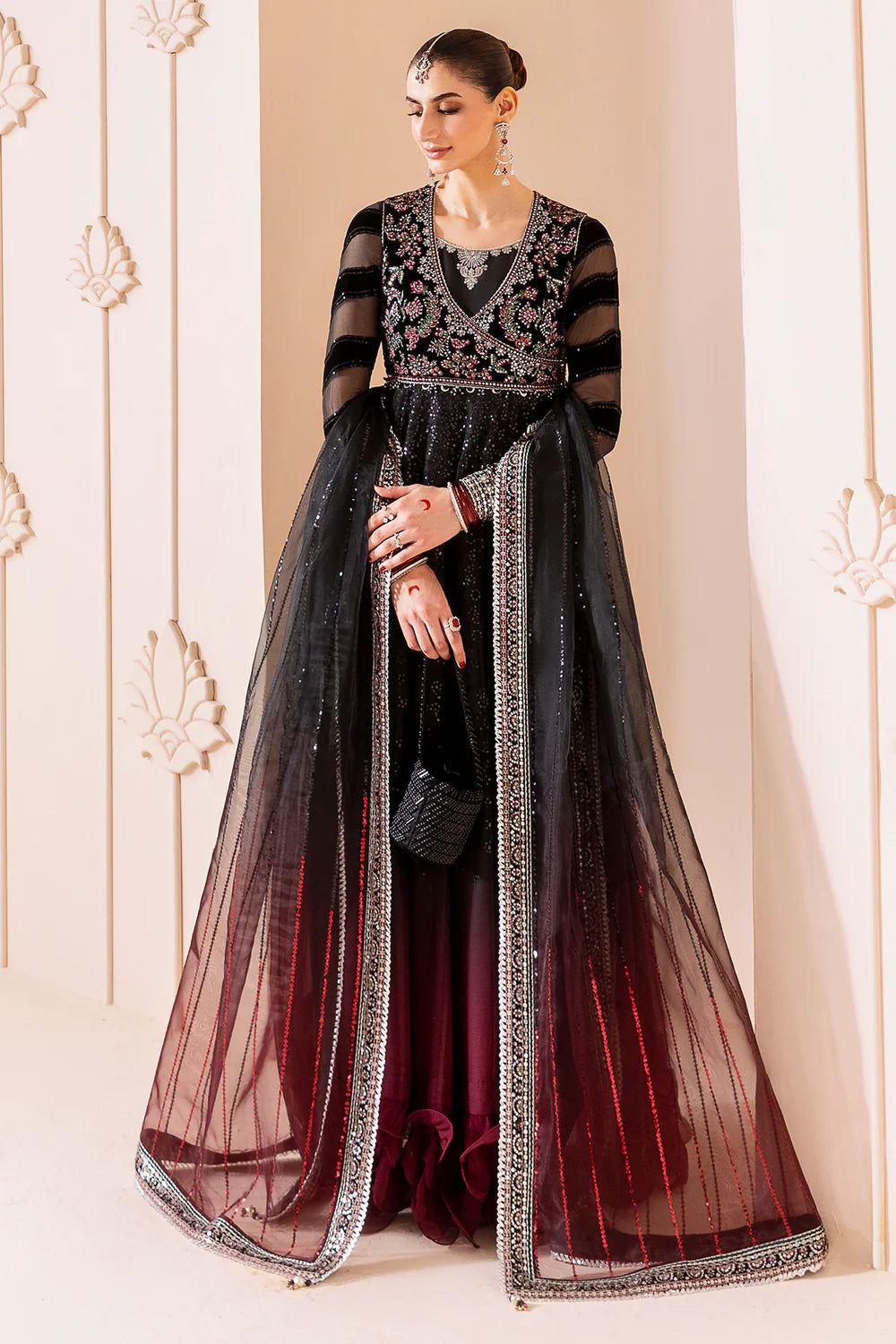 Elegant formal suit with embroidered velvet, laser-embellished chiffon sleeves, and digital printed chiffon panels. Includes digital organza dupatta & silk lining.