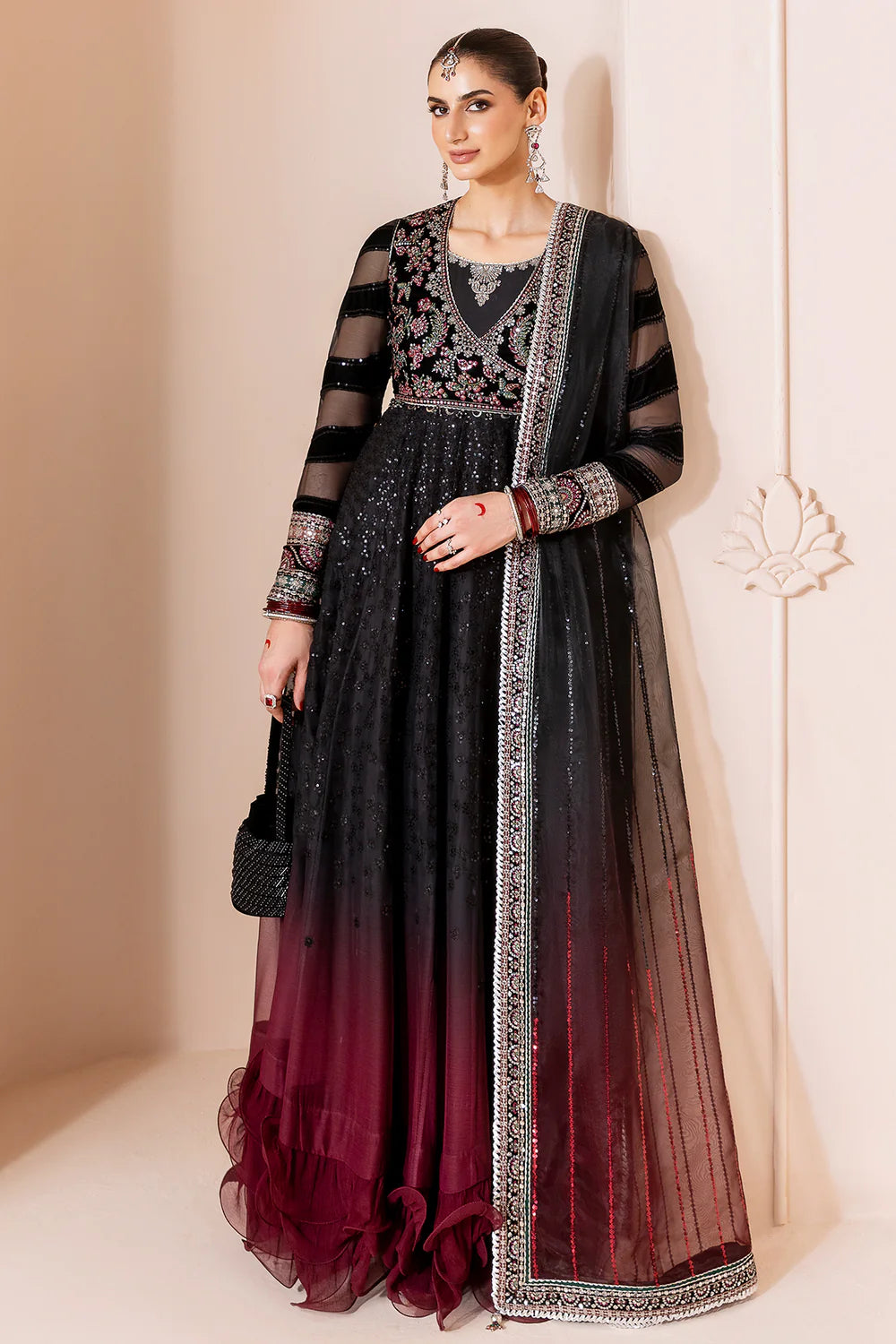 Elegant formal suit with embroidered velvet, laser-embellished chiffon sleeves, and digital printed chiffon panels. Includes digital organza dupatta & silk lining.