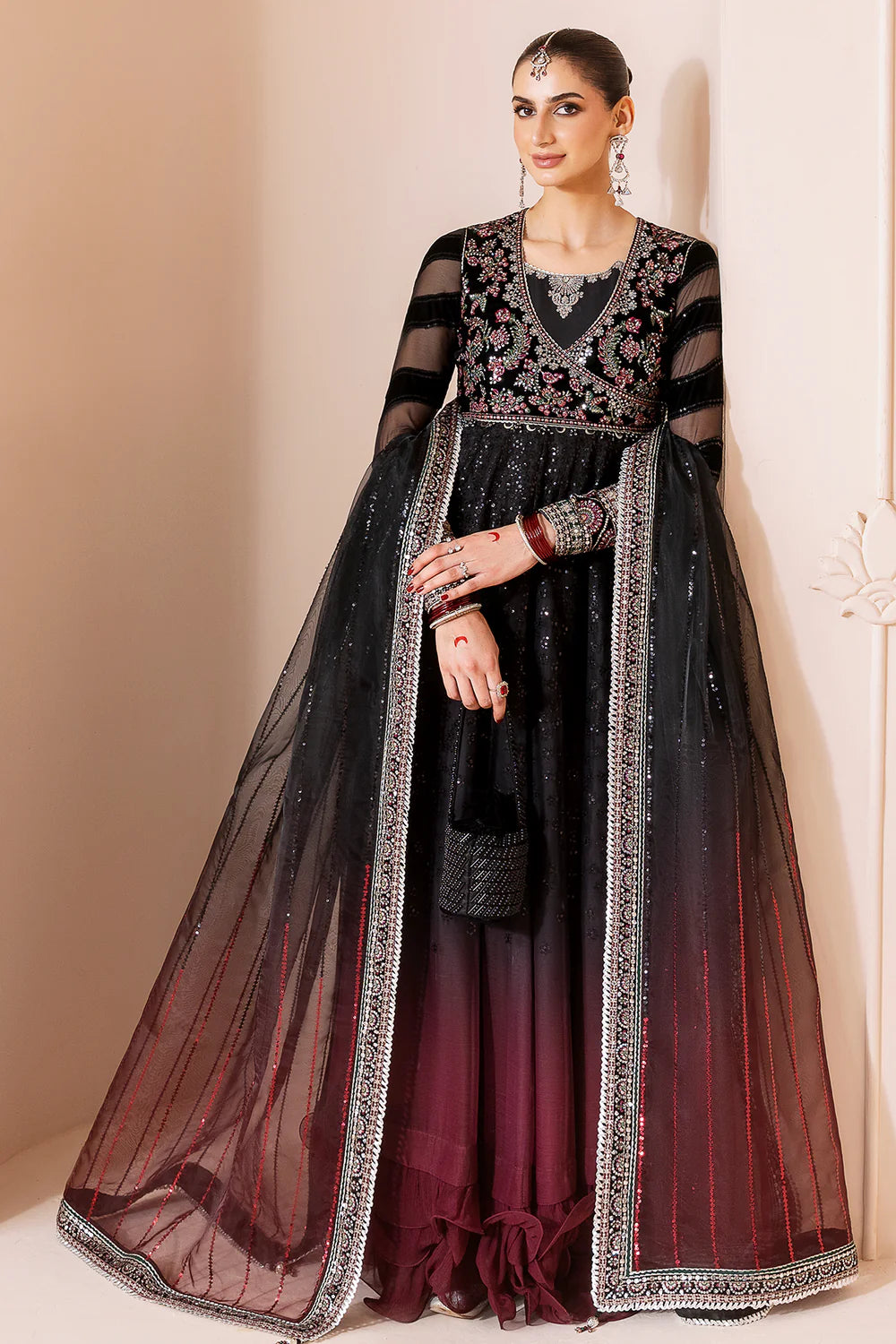 Elegant formal suit with embroidered velvet, laser-embellished chiffon sleeves, and digital printed chiffon panels. Includes digital organza dupatta & silk lining.