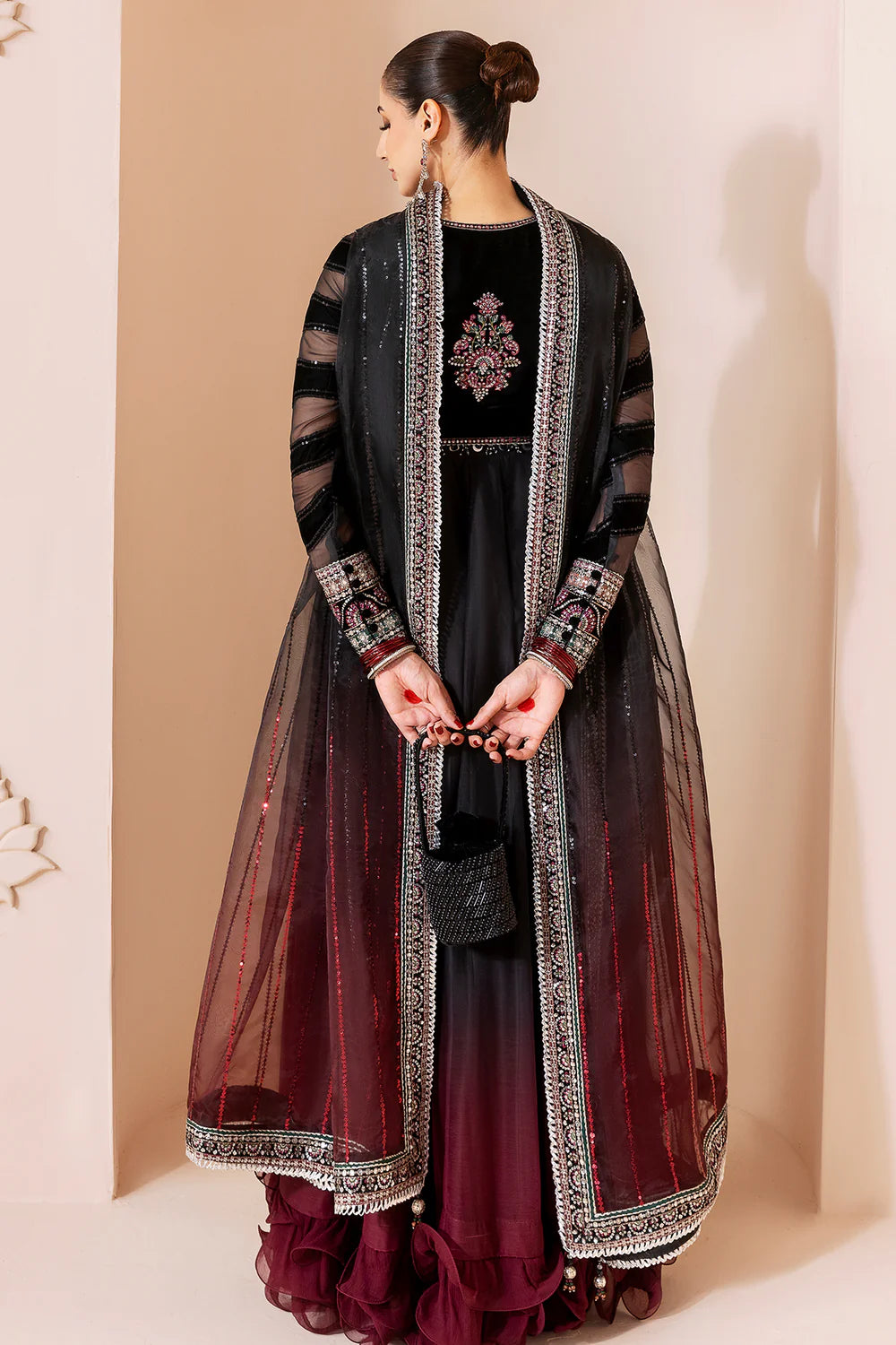 Elegant formal suit with embroidered velvet, laser-embellished chiffon sleeves, and digital printed chiffon panels. Includes digital organza dupatta & silk lining.