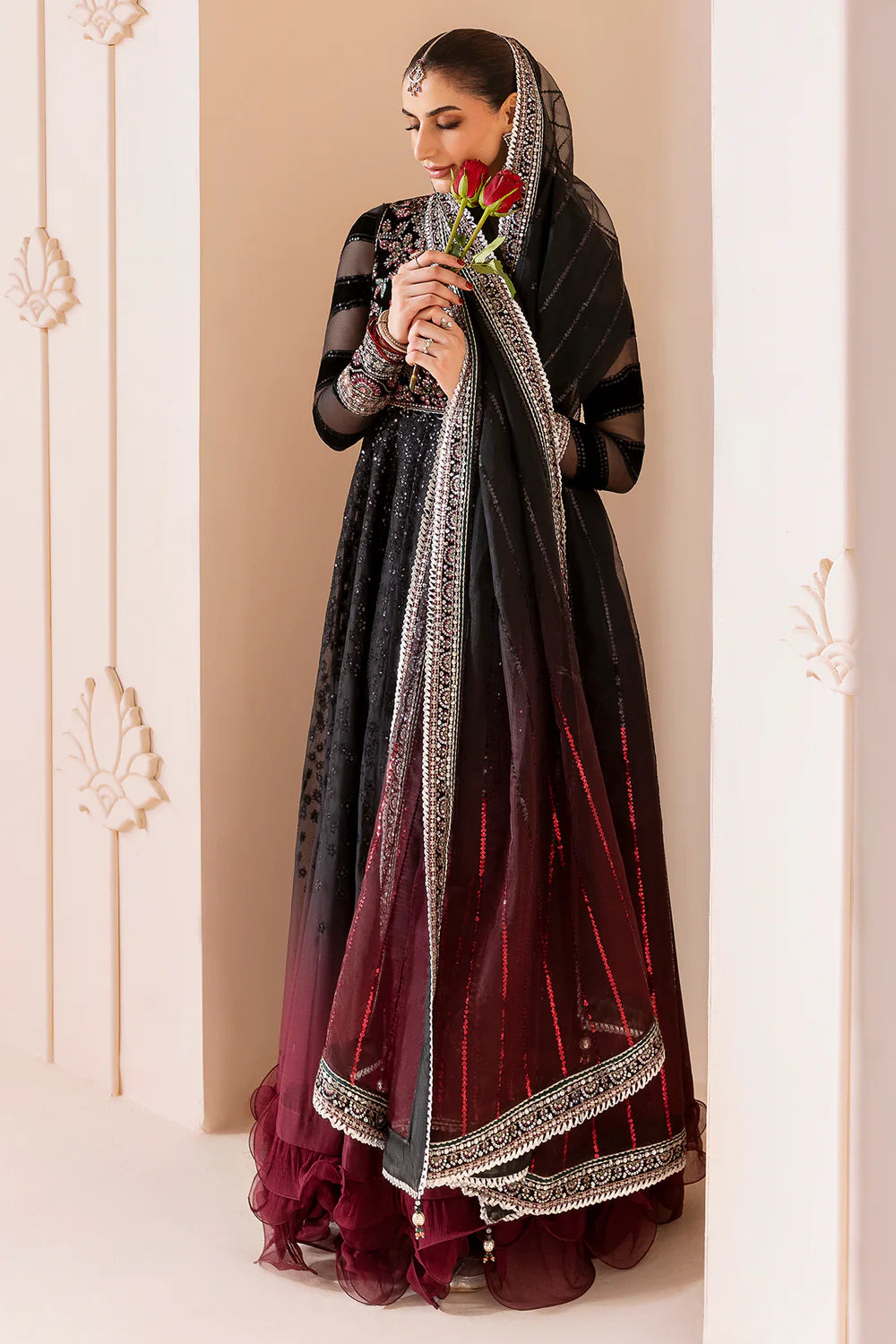 Elegant formal suit with embroidered velvet, laser-embellished chiffon sleeves, and digital printed chiffon panels. Includes digital organza dupatta & silk lining.