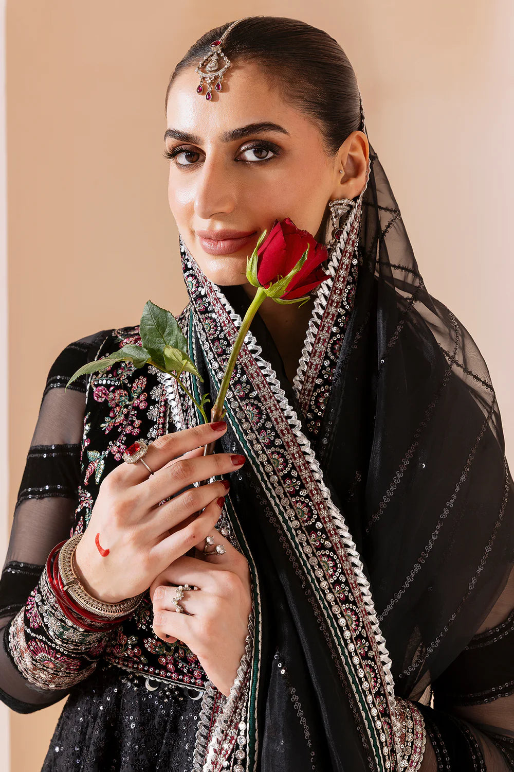 Elegant formal suit with embroidered velvet, laser-embellished chiffon sleeves, and digital printed chiffon panels. Includes digital organza dupatta & silk lining.