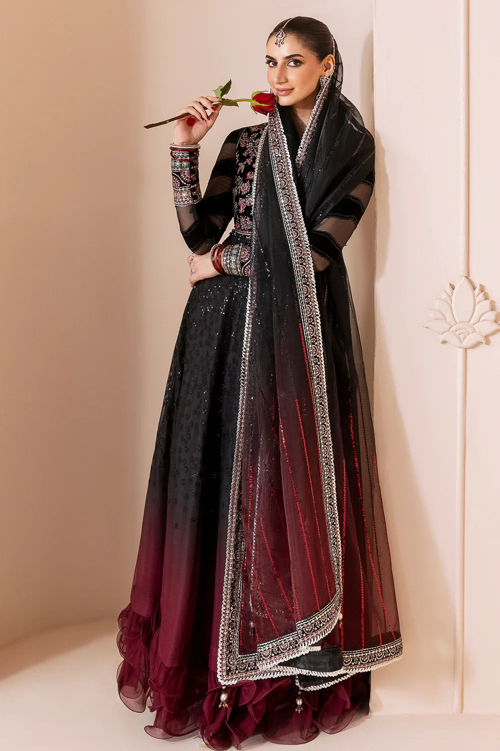 Elegant formal suit with embroidered velvet, laser-embellished chiffon sleeves, and digital printed chiffon panels. Includes digital organza dupatta & silk lining.