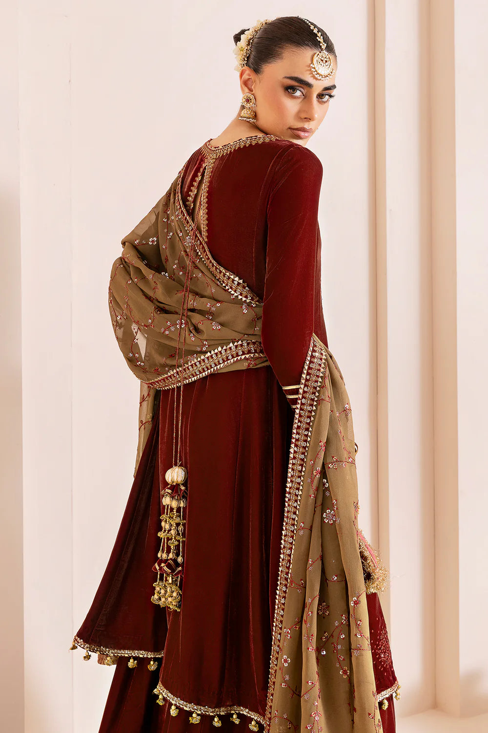 Luxurious pure velvet suit with intricate embroidery on panels, sleeves & borders. Includes embroidered georgette chiffon dupatta for a refined formal look.