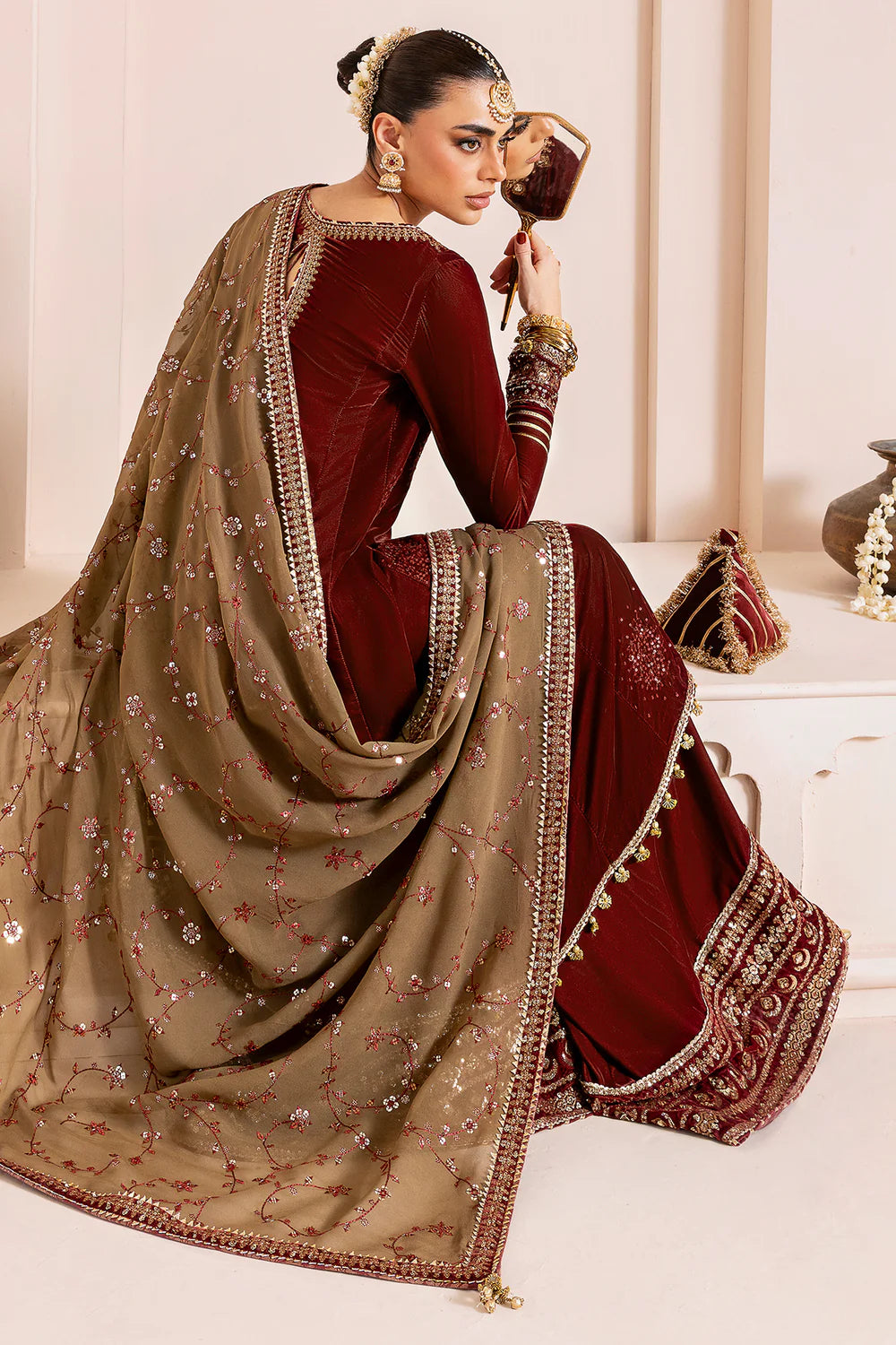 Luxurious pure velvet suit with intricate embroidery on panels, sleeves & borders. Includes embroidered georgette chiffon dupatta for a refined formal look.
