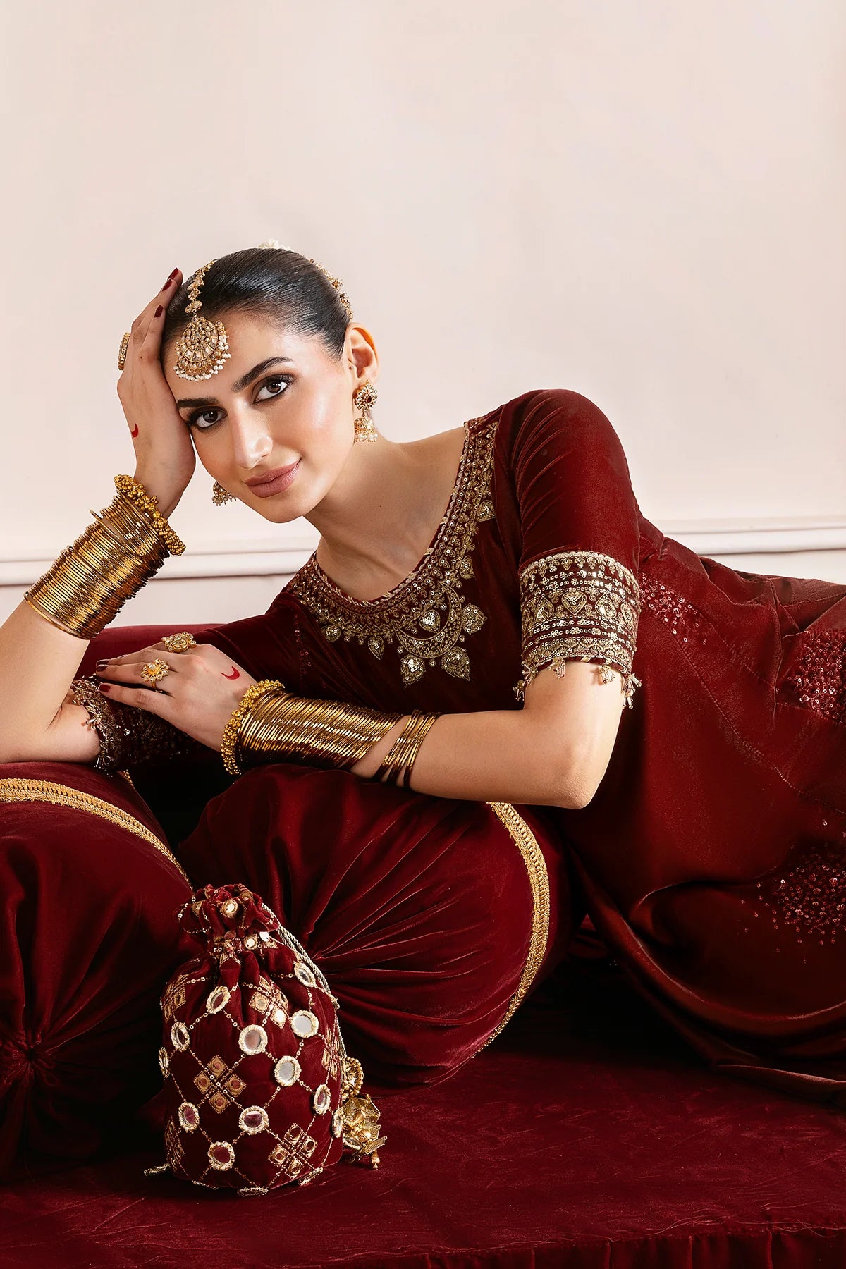 Elegant velvet suit with embroidered panels, rich borders & georgette chiffon dupatta. Perfect for formal wear & festive events. A timeless, luxe statement.
