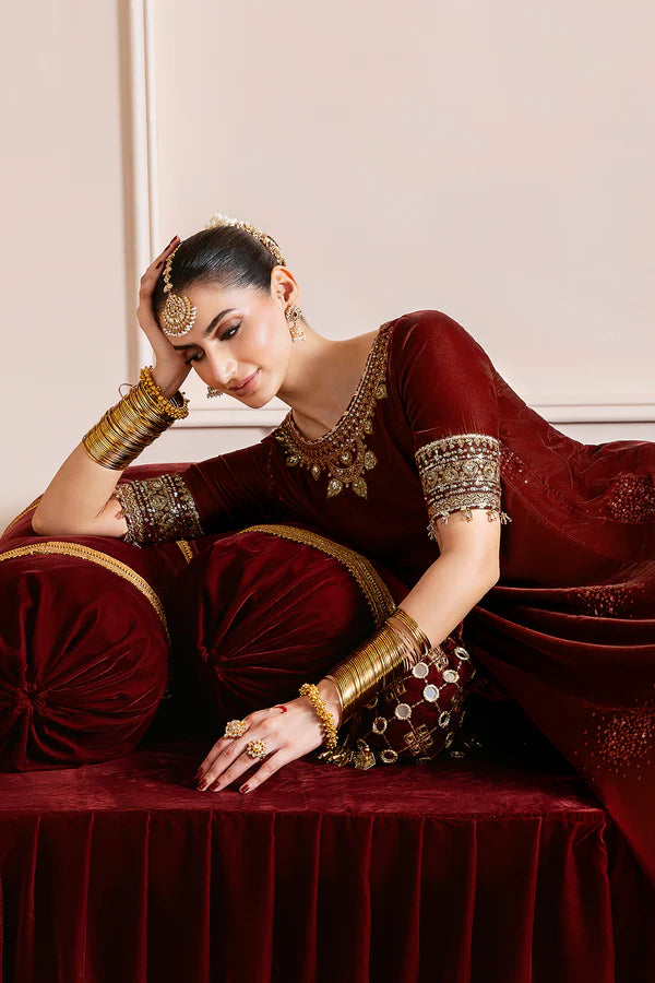 Elegant velvet suit with embroidered panels, rich borders & georgette chiffon dupatta. Perfect for formal wear & festive events. A timeless, luxe statement.