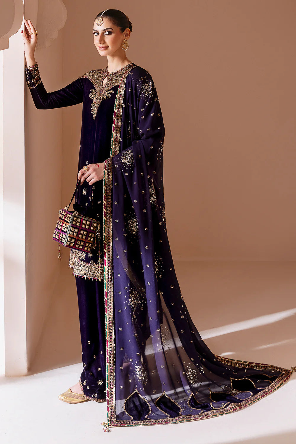 Elegant pure velvet formal dress with rich embroidery and chiffon dupatta. A luxurious outfit crafted for timeless sophistication and formal grace.