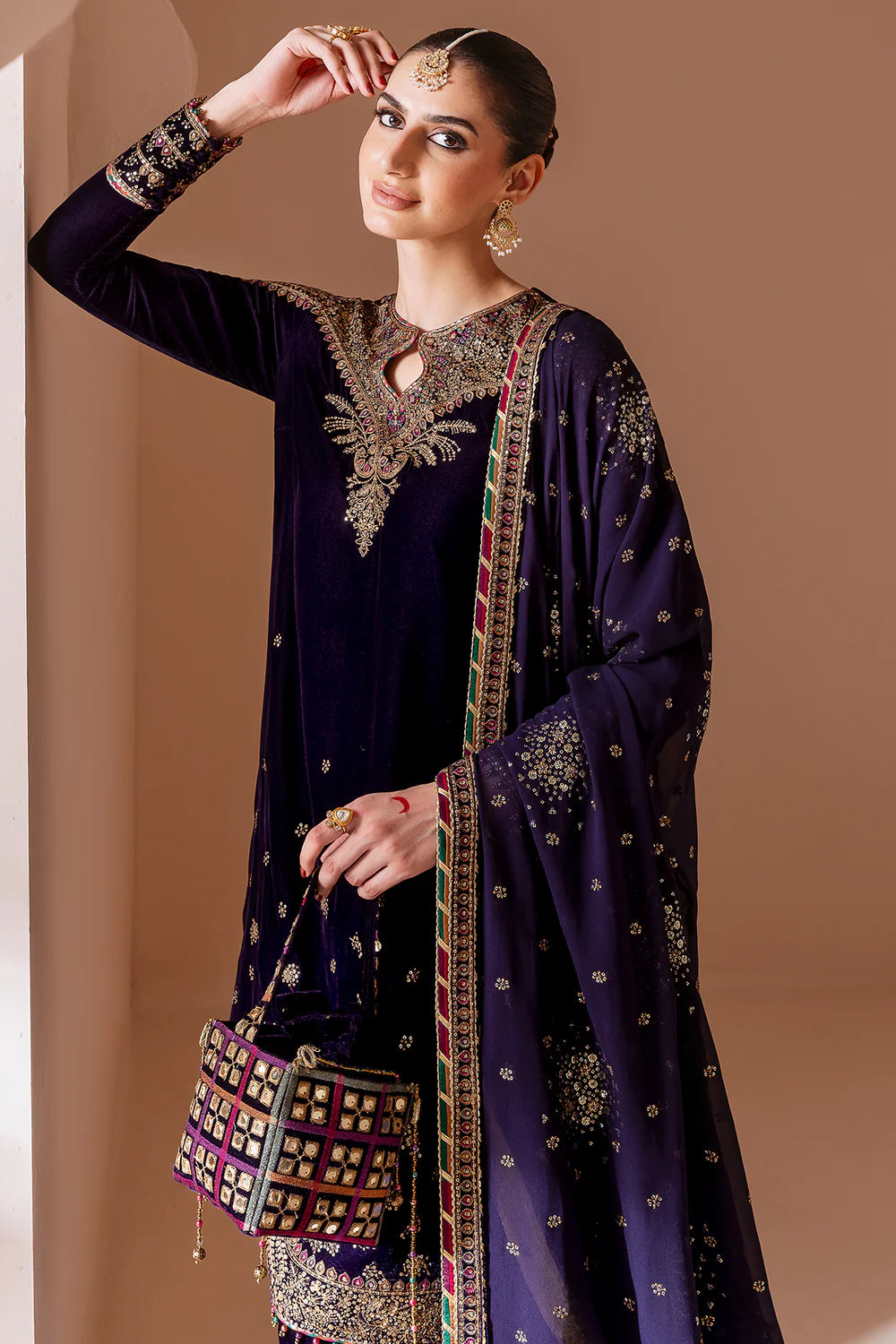 Elegant pure velvet formal dress with rich embroidery and chiffon dupatta. A luxurious outfit crafted for timeless sophistication and formal grace.