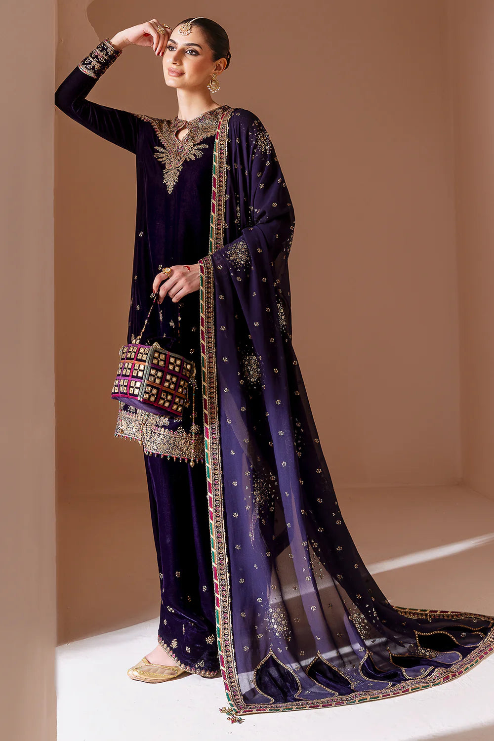Elegant pure velvet formal dress with rich embroidery and chiffon dupatta. A luxurious outfit crafted for timeless sophistication and formal grace.