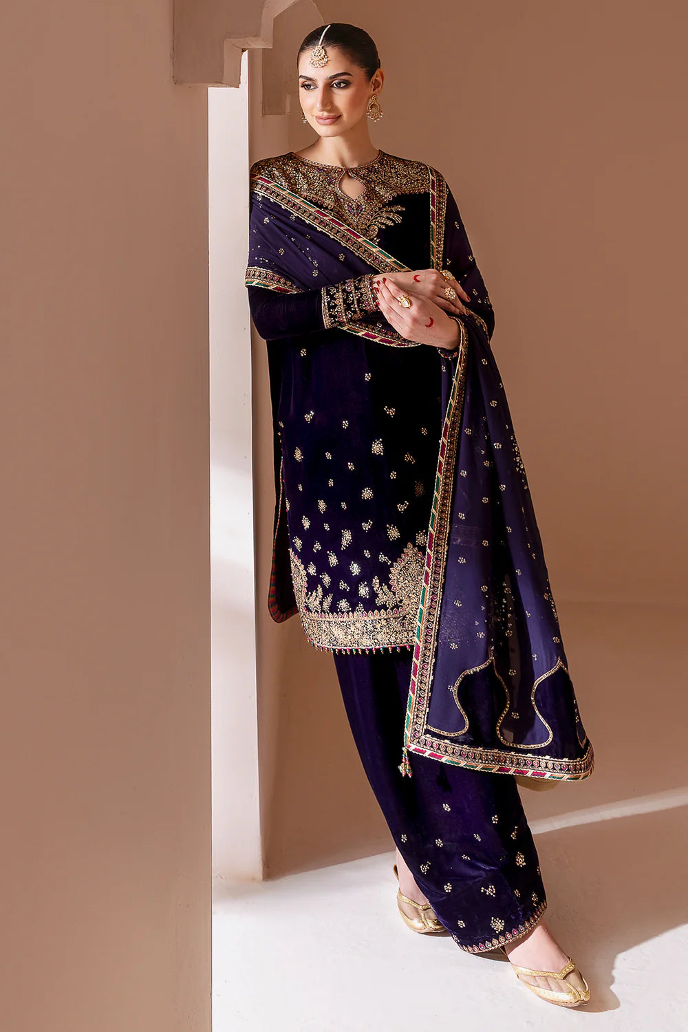 Elegant pure velvet formal dress with rich embroidery and chiffon dupatta. A luxurious outfit crafted for timeless sophistication and formal grace.