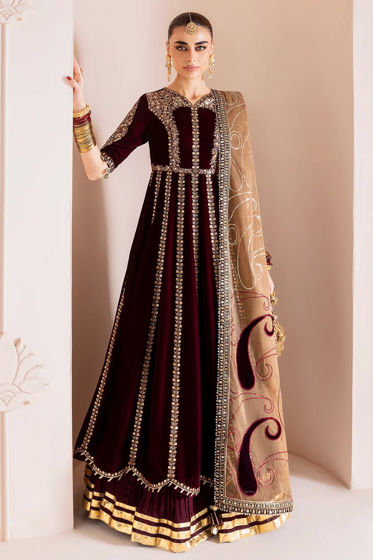 Luxurious velvet formal dress with intricate embroidery, organza dupatta, and silk crushed bottom. A timeless unstitched outfit for elegant evening wear.