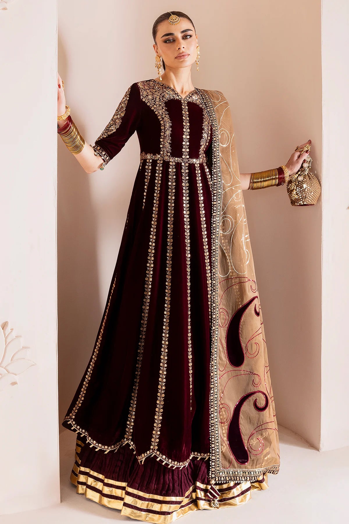 Luxurious velvet formal dress with intricate embroidery, organza dupatta, and silk crushed bottom. A timeless unstitched outfit for elegant evening wear.