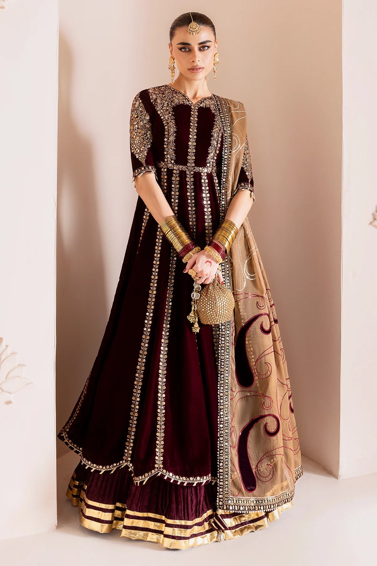 Luxurious velvet formal dress with intricate embroidery, organza dupatta, and silk crushed bottom. A timeless unstitched outfit for elegant evening wear.