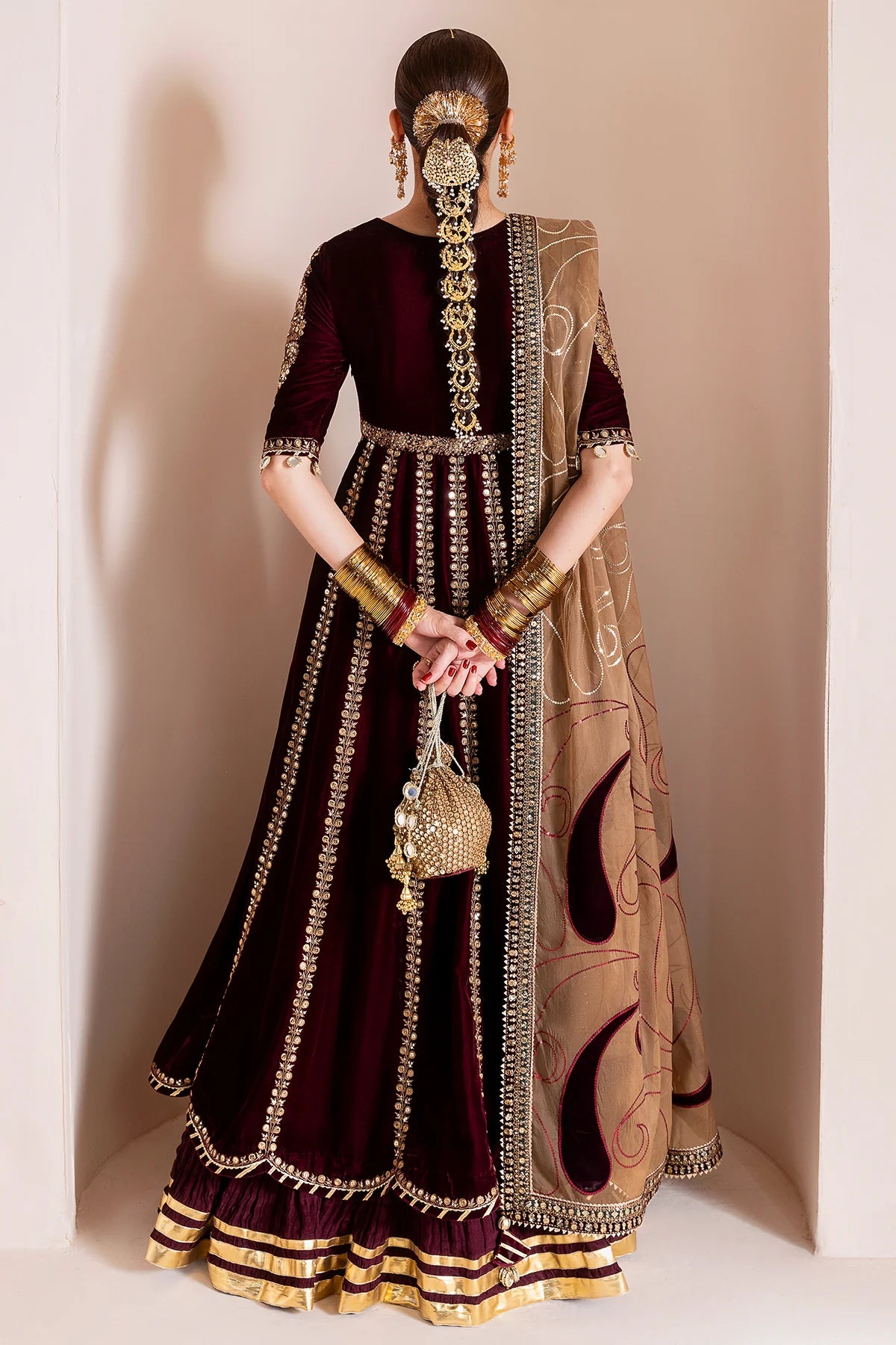Luxurious velvet formal dress with intricate embroidery, organza dupatta, and silk crushed bottom. A timeless unstitched outfit for elegant evening wear.