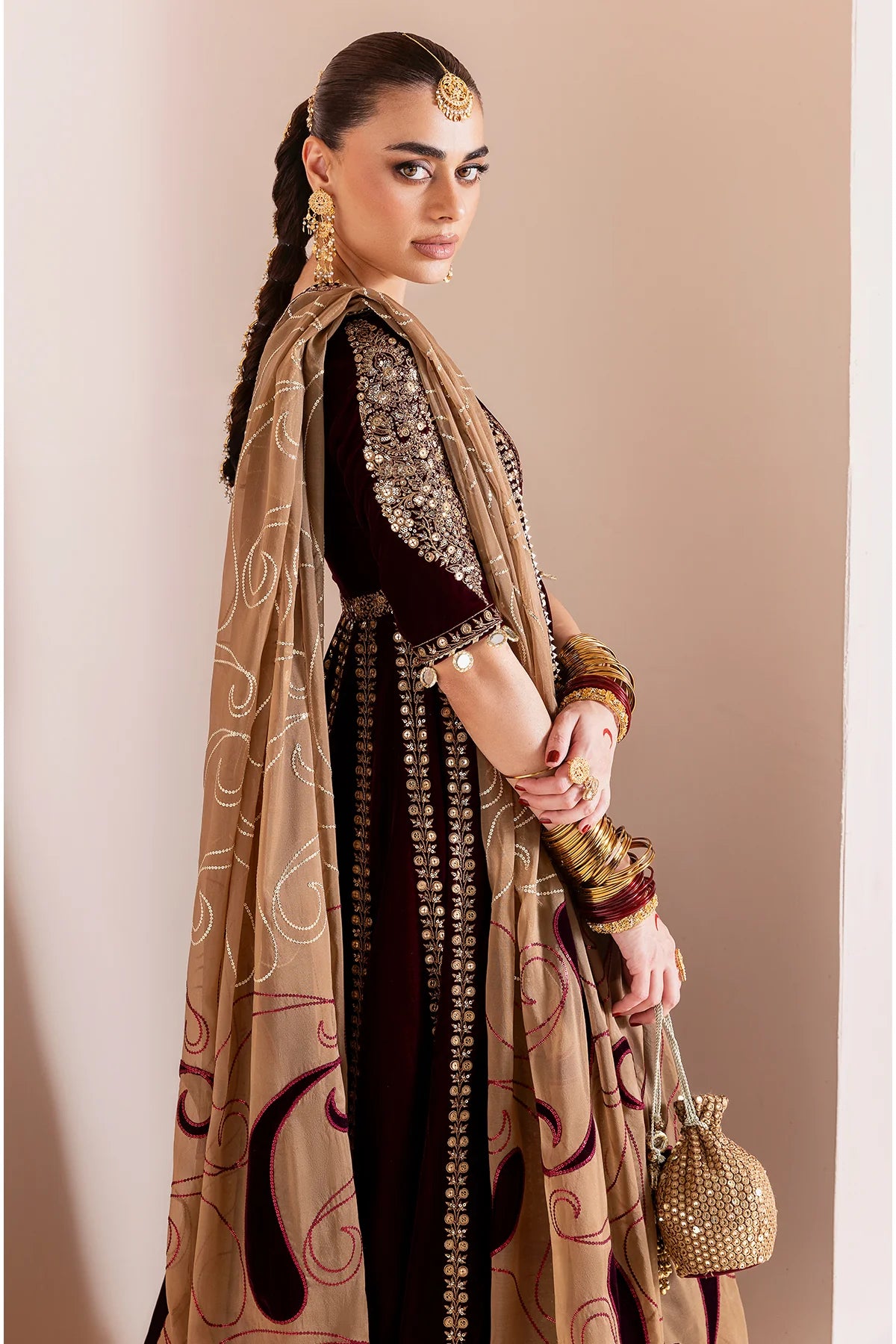 Luxurious velvet formal dress with intricate embroidery, organza dupatta, and silk crushed bottom. A timeless unstitched outfit for elegant evening wear.