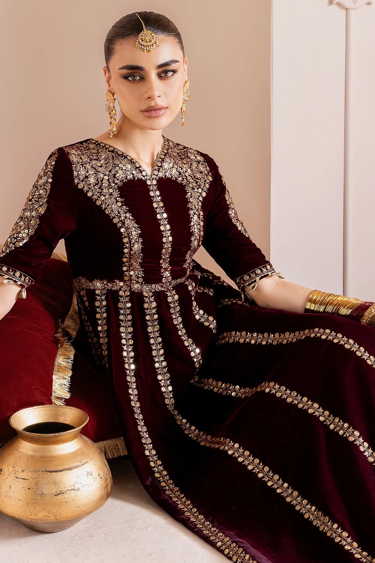 Luxurious velvet formal dress with intricate embroidery, organza dupatta, and silk crushed bottom. A timeless unstitched outfit for elegant evening wear.