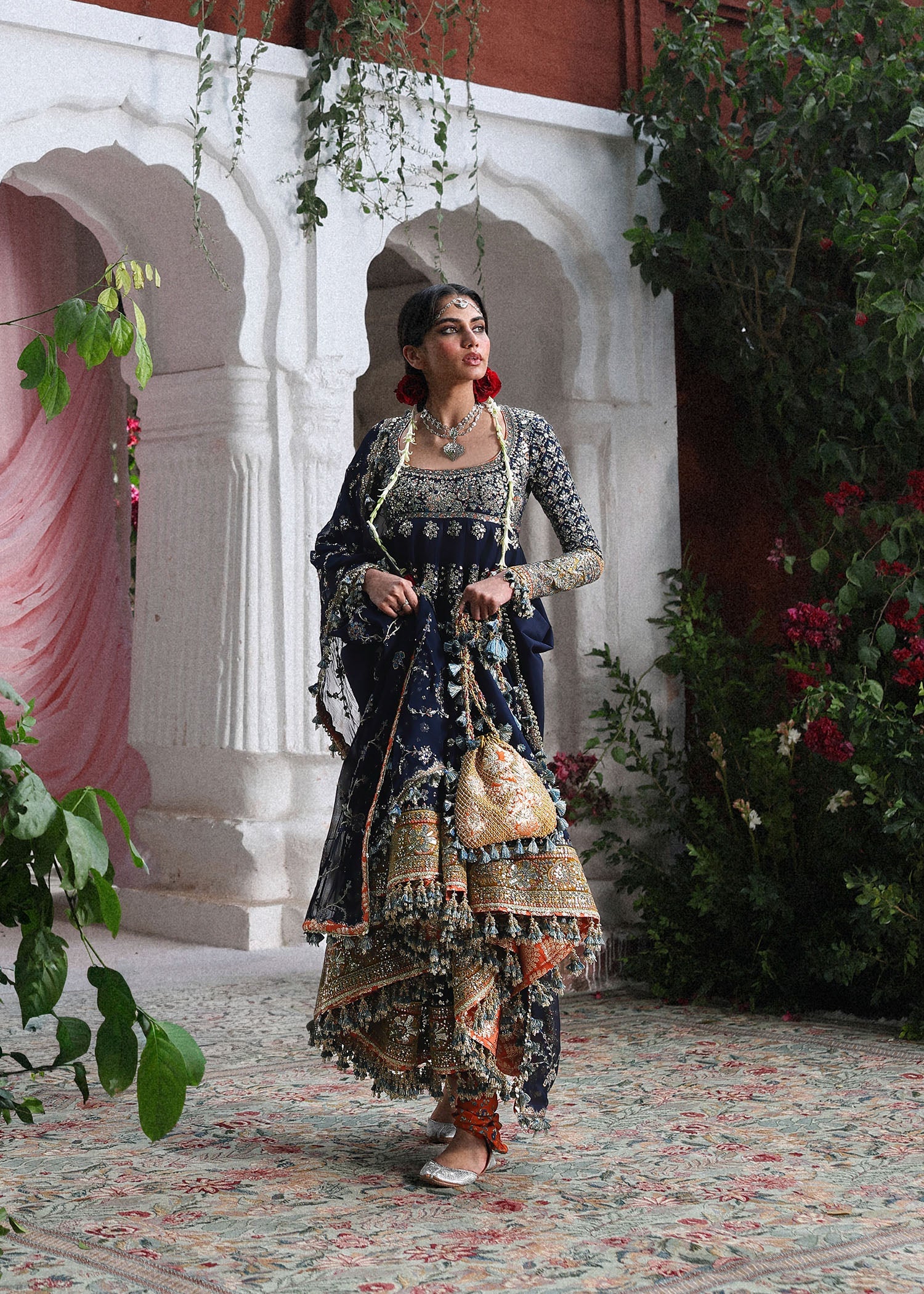 Elegant navy blue Korean raw silk pishwas with embroidered panels and sleeves, paired with printed chooridar and chiffon dupatta with four-sided borders.
