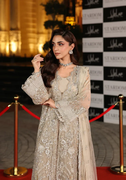 Stardust by Elaf Stardom ’25 features hand-embroidered organza panels, embroidered poly-net dupatta, and raw silk inner — ideal for festive and formal elegance.