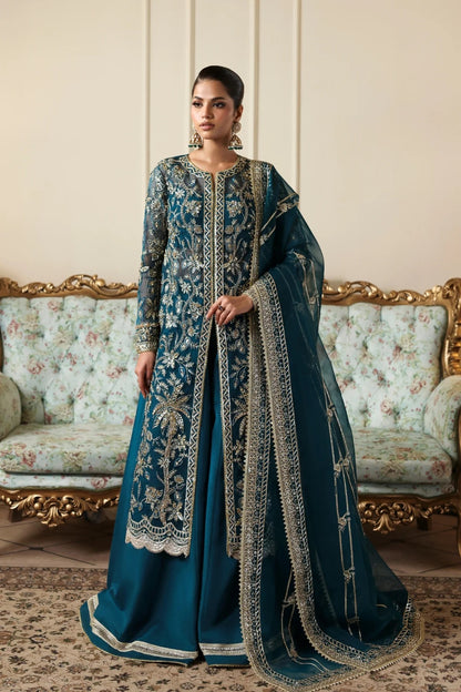 Refined organza dress with hand-embellished panels, sleeves, and borders. Includes embroidered dupatta, Russian grip inner, and raw silk trouser fabric.
