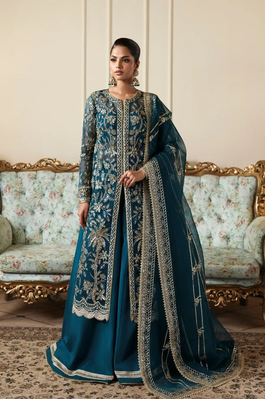Refined organza dress with hand-embellished panels, sleeves, and borders. Includes embroidered dupatta, Russian grip inner, and raw silk trouser fabric.