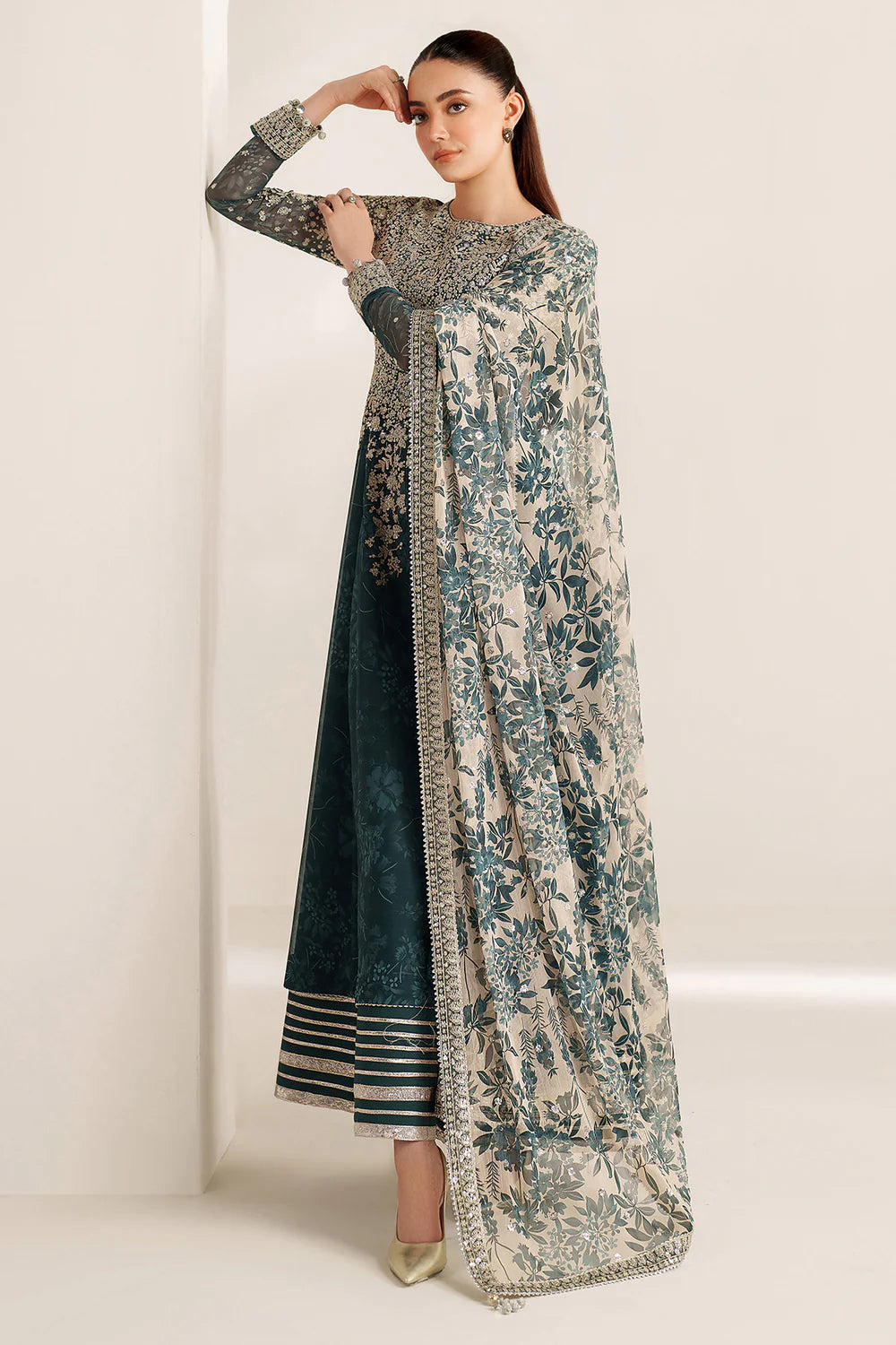 Elegant embroidered chiffon ensemble with printed yoke and panels, delicate sleeve borders, flowing back, embroidered dupatta, and raw silk bottom for timeless style.
