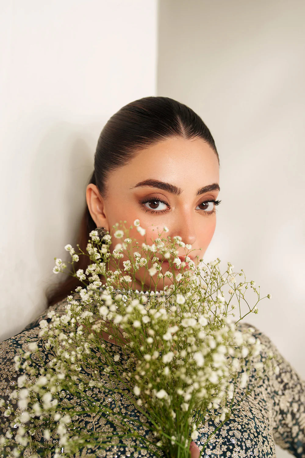 Elegant embroidered chiffon ensemble with printed yoke and panels, delicate sleeve borders, flowing back, embroidered dupatta, and raw silk bottom for timeless style.