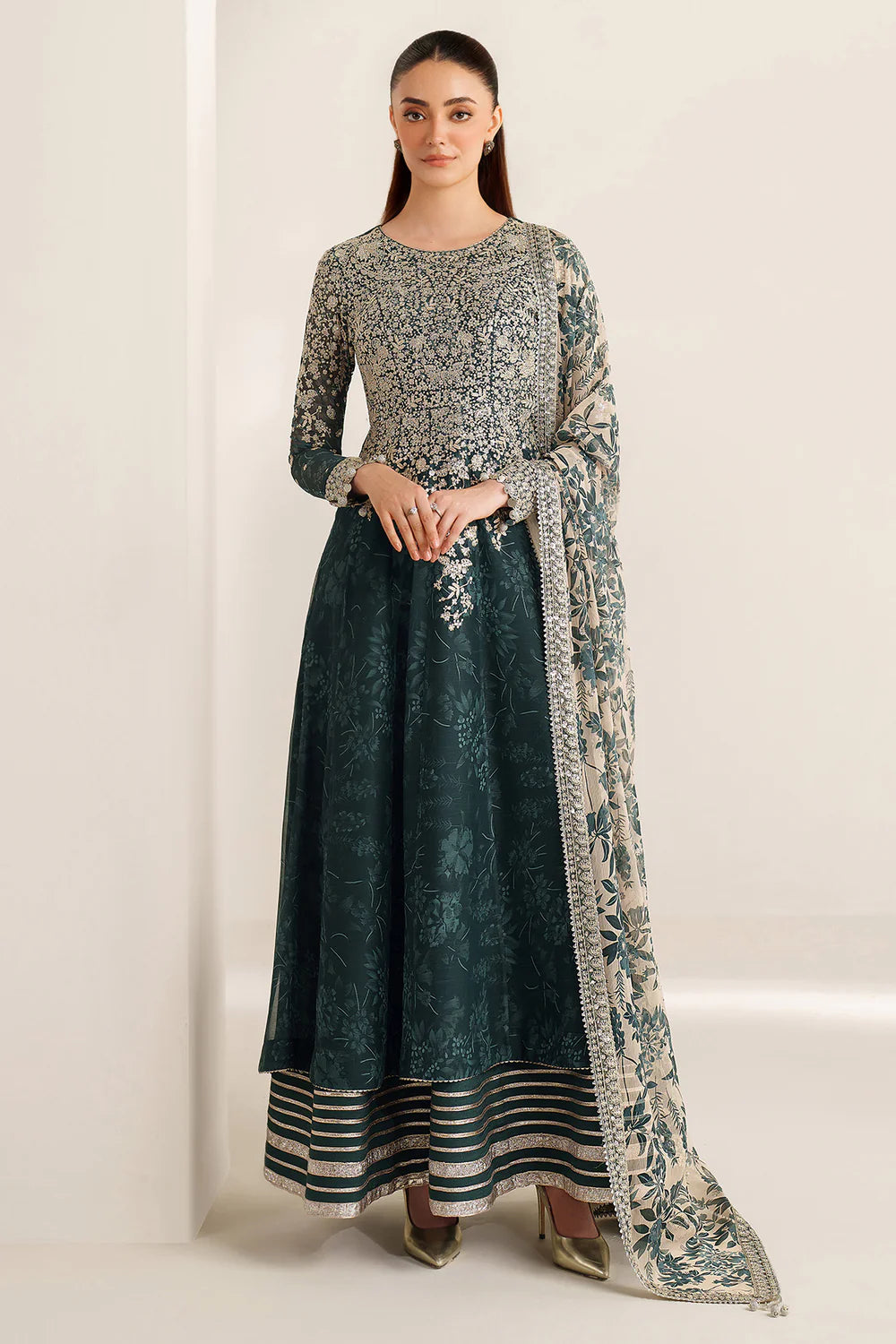 Elegant embroidered chiffon ensemble with printed yoke and panels, delicate sleeve borders, flowing back, embroidered dupatta, and raw silk bottom for timeless style.